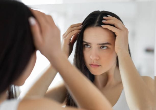 Woman having problem with hair loss